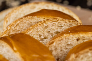Wheat baguette on a wooden cutting board