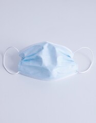 Vertical shot of a face mask on the white background