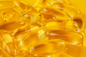 Fish oil capsules with omega 3 and vitamin D background