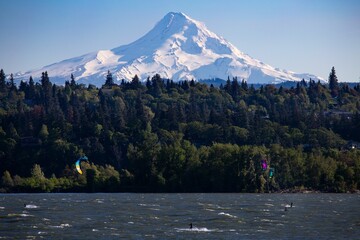 Kite surfers on the Columbia River with Mount Hood in the distance. Oregon, USA.
