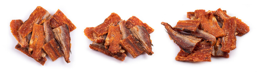 Pieces of cleaned dried fish isolated on white. Dry Peppered Pollack. Amber with pepper Collection