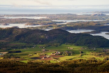 Fototapeta na wymiar Beautiful landscape of a coastline and a village in Norway, Atlantic Ocean Road