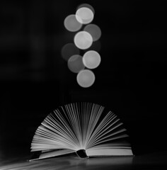 open book and bokeh balls, education knowledge,learning,inspiration concept.