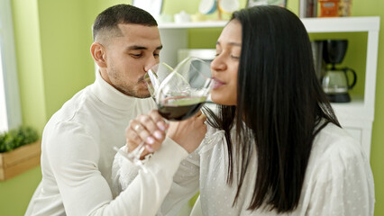 Man and woman couple drinking wine at home