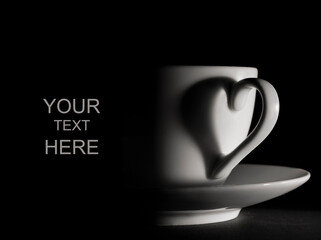 A template with a cup of coffee or tea on black background with 