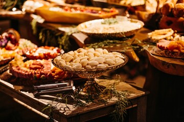 Wooden table with a variety of sweets and dishes