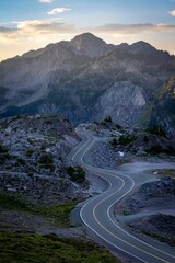 Vertical high-angle view of a long curvy road in the mountains