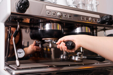 Professional barista makes cappuccino during social distance.