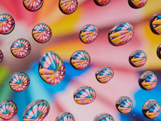 Water drops on the texture of a colored background. the rear window is covered with water droplets. bubbles in the water
