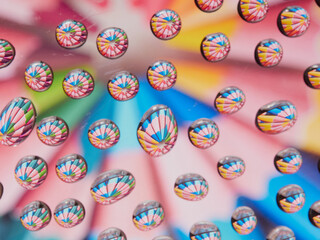 Water drops on the texture of a colored background. the rear window is covered with water droplets. bubbles in the water