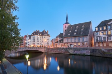 Fototapeta na wymiar Beautiful view of traditional buildings near the tranquil Ill river in Strasbourg, France
