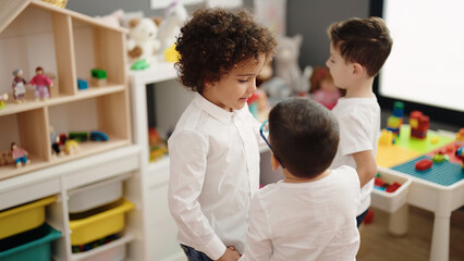 Obraz premium Group of kids students dancing at kindergarten