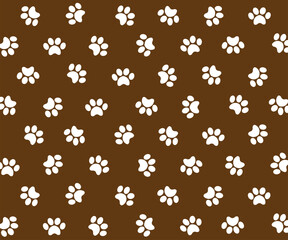 Fototapeta na wymiar Repetitive white animal footprint pattern on a brown background.