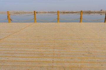 Empty dock against the background of the lake.