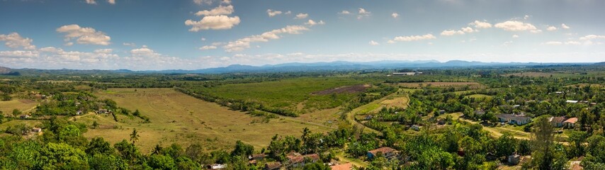 Panoramic view of the Valle de los Ingenios fields with blue sky in Trinidad, Cuba