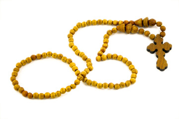 Rosary beads on white background