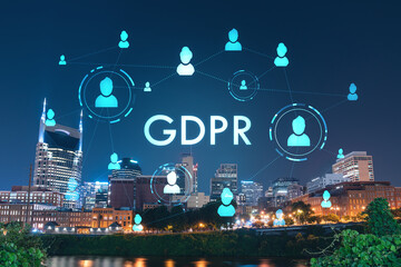 Panoramic view of Broadway district of Nashville over Cumberland River at illuminated night skyline, Tennessee, USA. GDPR hologram, concept of data protection regulation and privacy for individuals