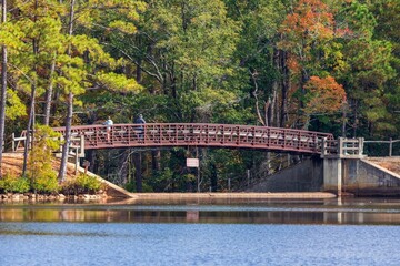 Bridge on a lake against autumn trees at Cheraw State Park in Chesterfield County, South Carolina