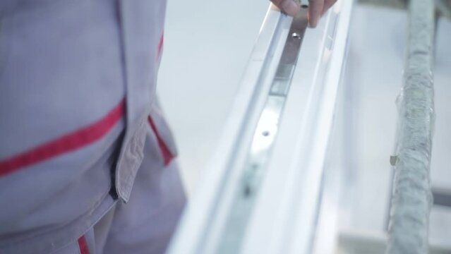 shop for the production of plastic windows. Workers make plastic windows, work machines and drills
