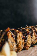 isolated sushi and rolls on a dark contrasting background, menu format

