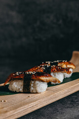isolated sushi and rolls on a dark contrasting background, menu format

