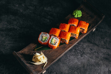 isolated sushi and rolls on a dark contrasting background, menu format

