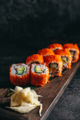 isolated sushi and rolls on a dark contrasting background, menu format

