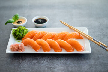 Fresh Sushi Roll with salmon.Japanese food. Copyspace black background.