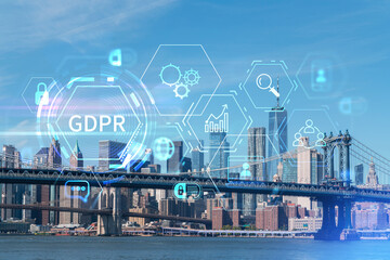 Brooklyn and Manhattan bridges with New York City financial downtown skyline panorama at day time over East River. GDPR hologram, concept of data protection, regulation and privacy for all individuals
