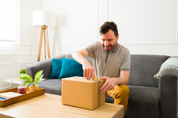 Excited man receiving a surprise package at home