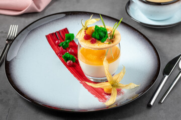 Panna cotta on stone table in fine dining restaurant
