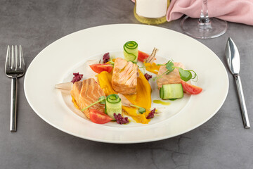Smoked salmon on stone table in fine dining restaurant