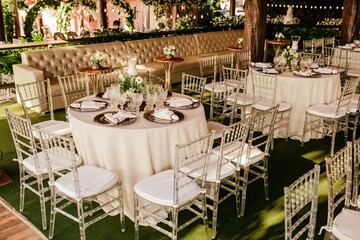 High-angle of the interior of a restaurant with white tablecloths and dishes