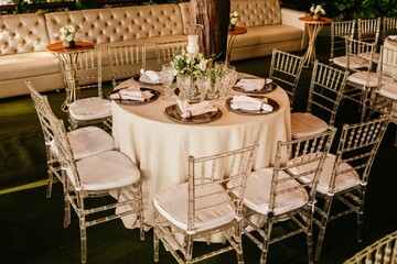 High-angle of the interior of a restaurant with white tablecloths and dishes