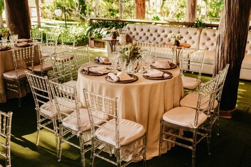 Closeup of the interior of a restaurant with white tablecloths and dishes