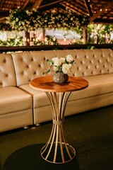 Closeup of the interior of a restaurant with white tablecloths and dishes