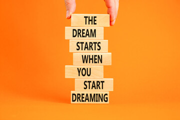 Start dreaming symbol. Concept words The dream starts when you start dreaming on wooden blocks....
