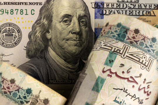 Egyptian pound and US dollars top view.Exchange rate, inflation, and Egyptian economy concept