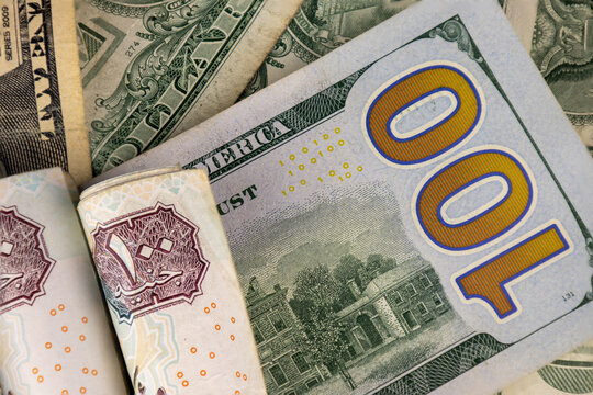 Egyptian pound and US dollars top view.Exchange rate, inflation, and Egyptian economy concept