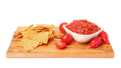 Board with bowl of delicious salsa, nachos and ingredients isolated on white background