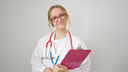 Young blonde woman doctor smiling confident holding clipboard over isolated white background