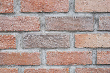 background red wall bricks with cement closeup