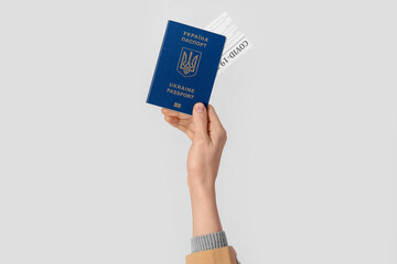 Woman with Ukrainian passport and negative covid-19 test result on light background