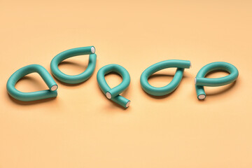 Hair curlers on yellow background