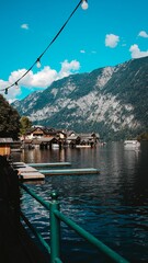 Vertical shot of the beautiful Hallstatt city with a lake and mountain view in Austria.