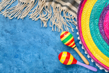 Mexican maracas with sombrero hat and serape on grunge background