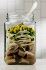 pickled herring in a jar step by step close-up