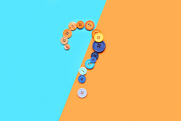 Question mark made of buttons on color background