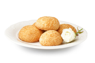 Plate with delicious choux pastry on white background