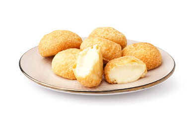 Plate with delicious choux pastry on white background